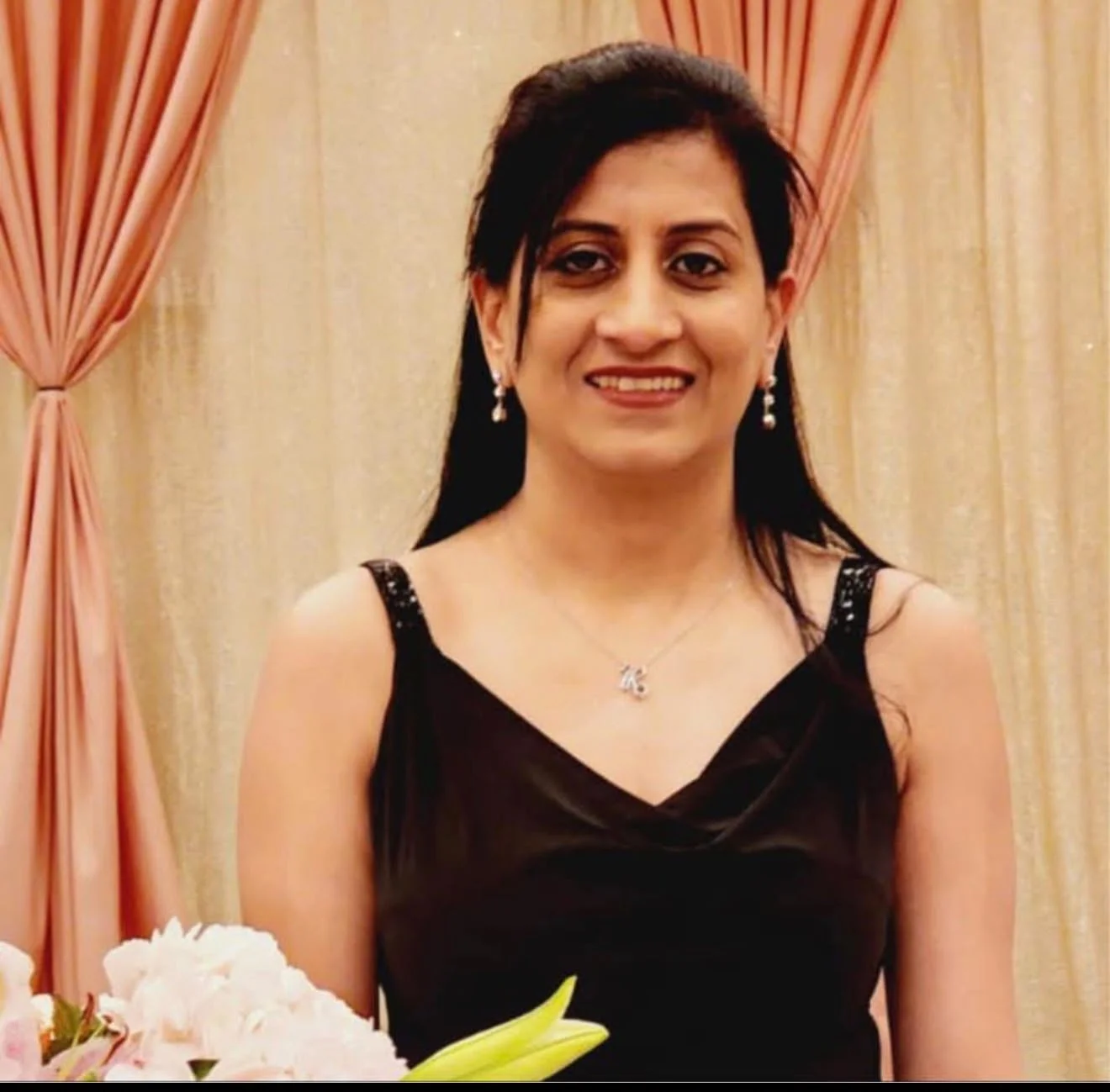 The founder of Reet Collections wearing a pink embroidered saree